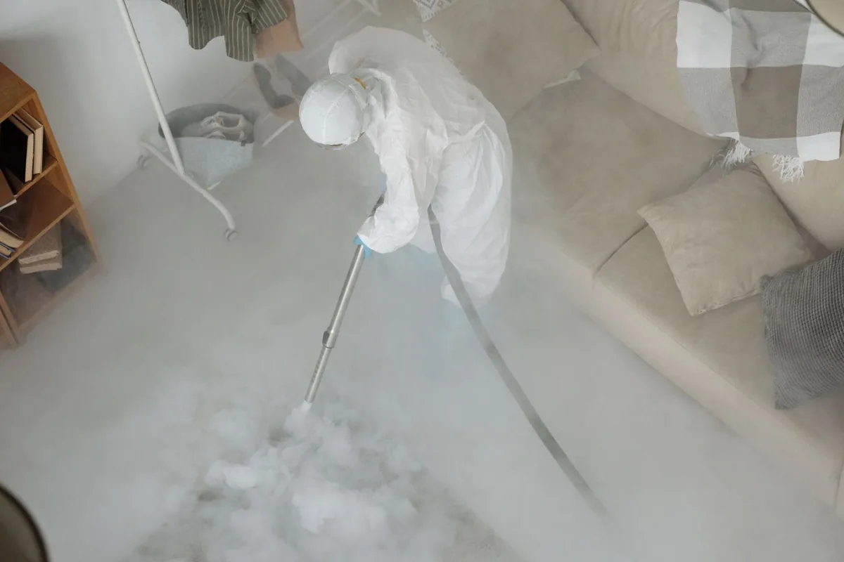Biohazard cleanup technician in protective equipment, Unionville, MO